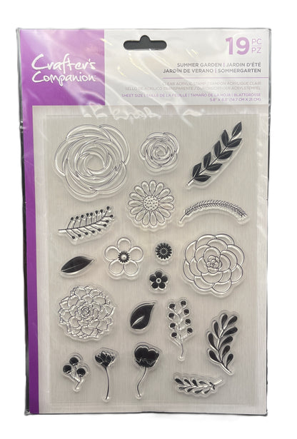 Packaged set of clear stamps with floral and leaf designs, brand 'Crafters Companion' visible.