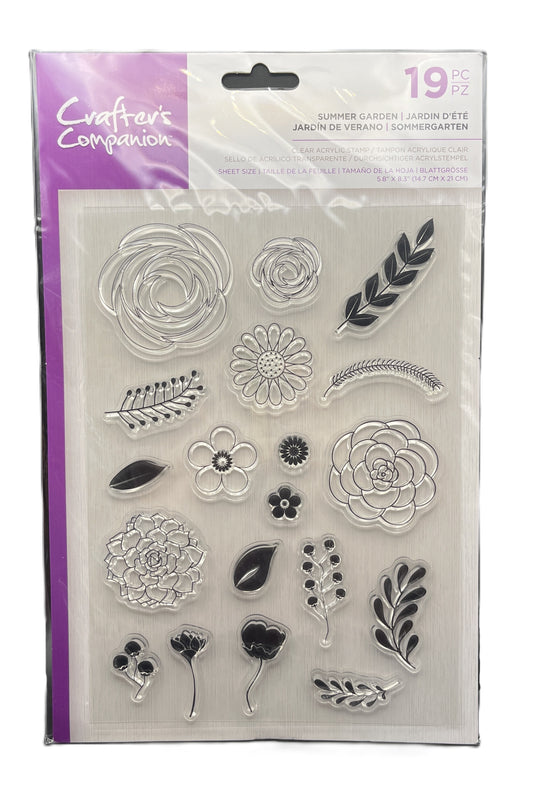 Packaged set of clear stamps with floral and leaf designs, brand 'Crafters Companion' visible.