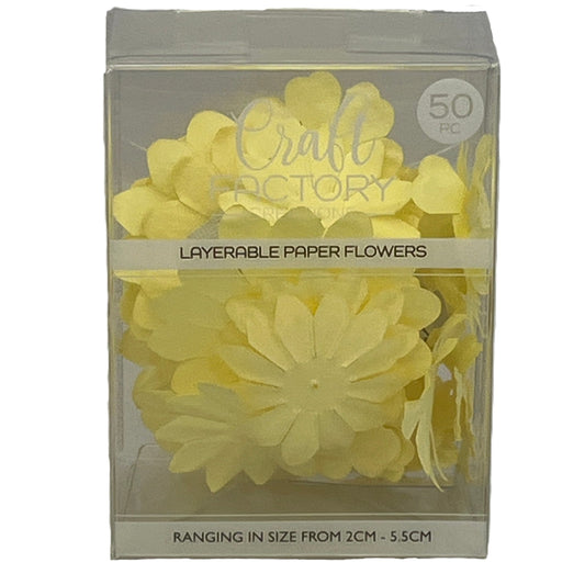 Packaged yellow layerable paper flowers with 'Craft Factory' branding.