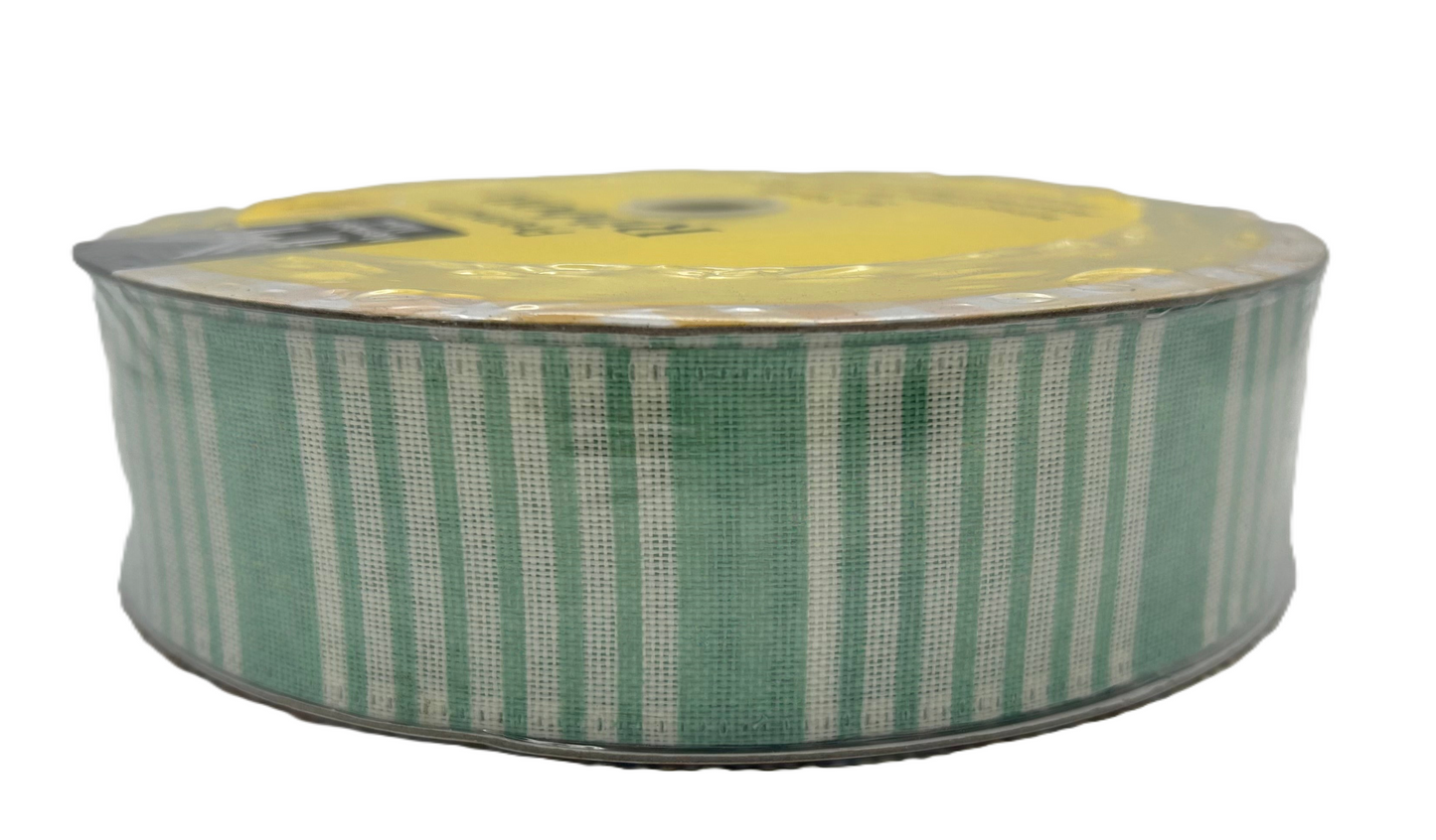 Roll of green and white striped ribbon on a white background