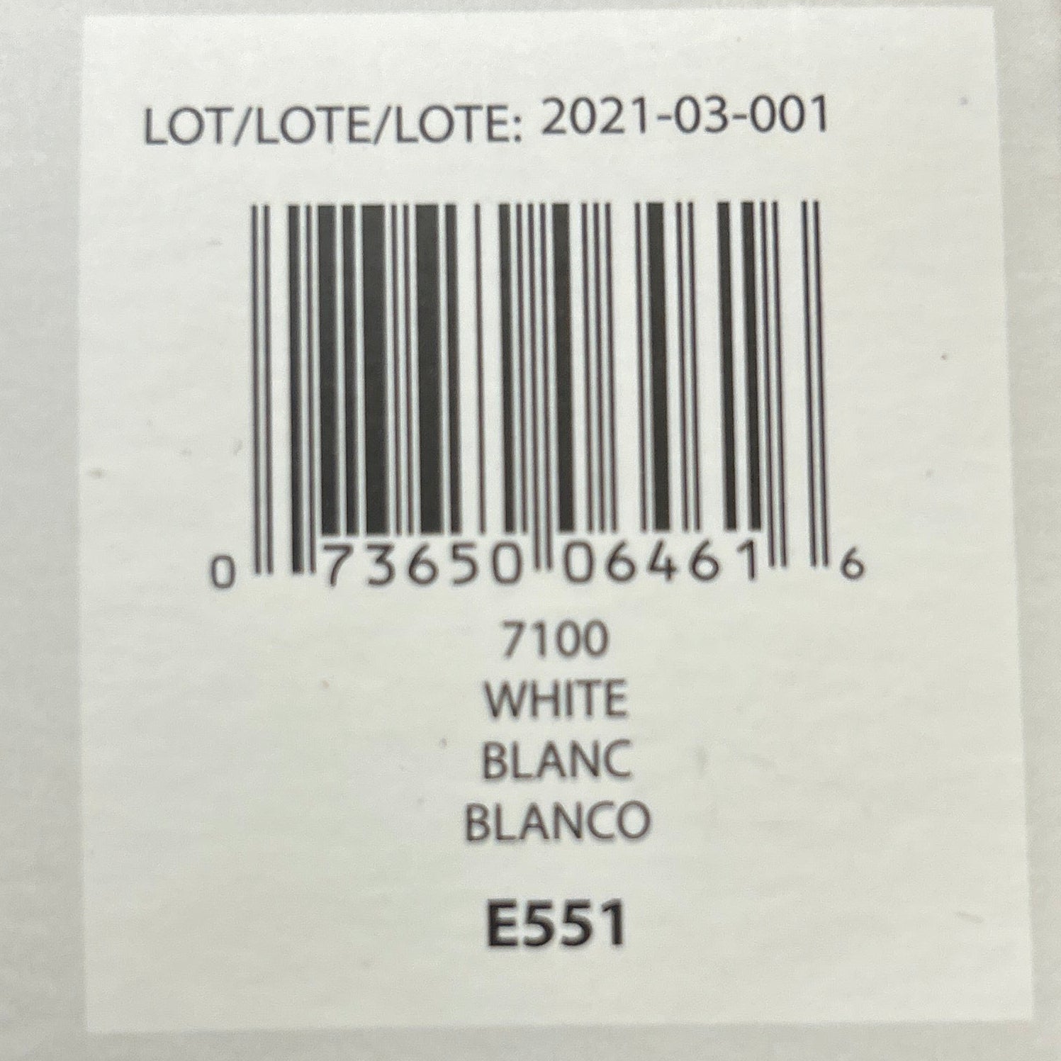 Product label with barcode and text on a wooden background