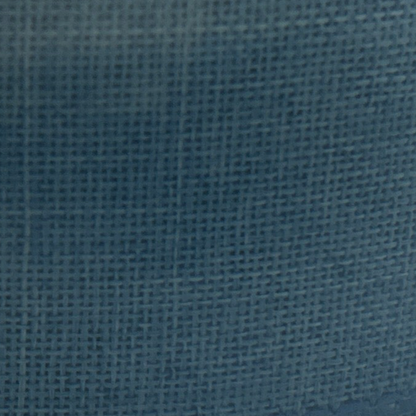 Close-up of a roll of blue fabric with a textured surface.