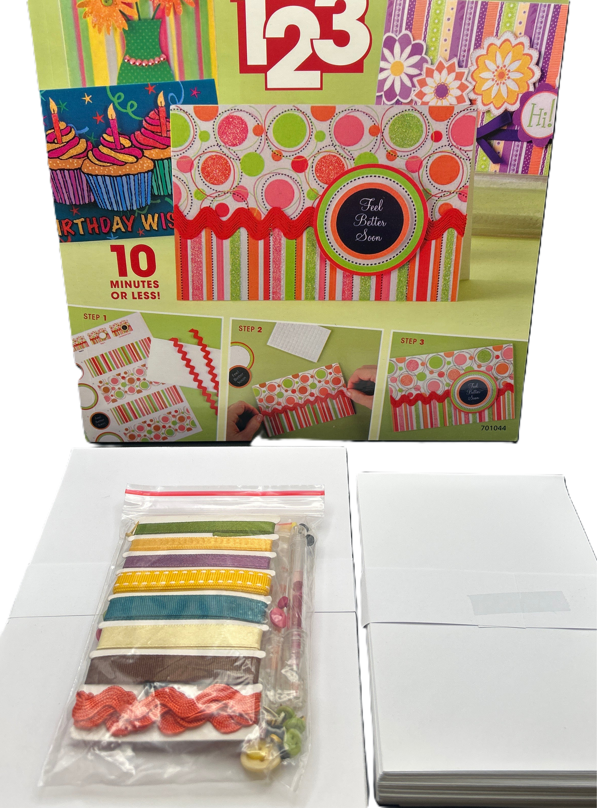 Colorful craft kit packaging with various designs and a smaller package of striped ribbons on a white background.