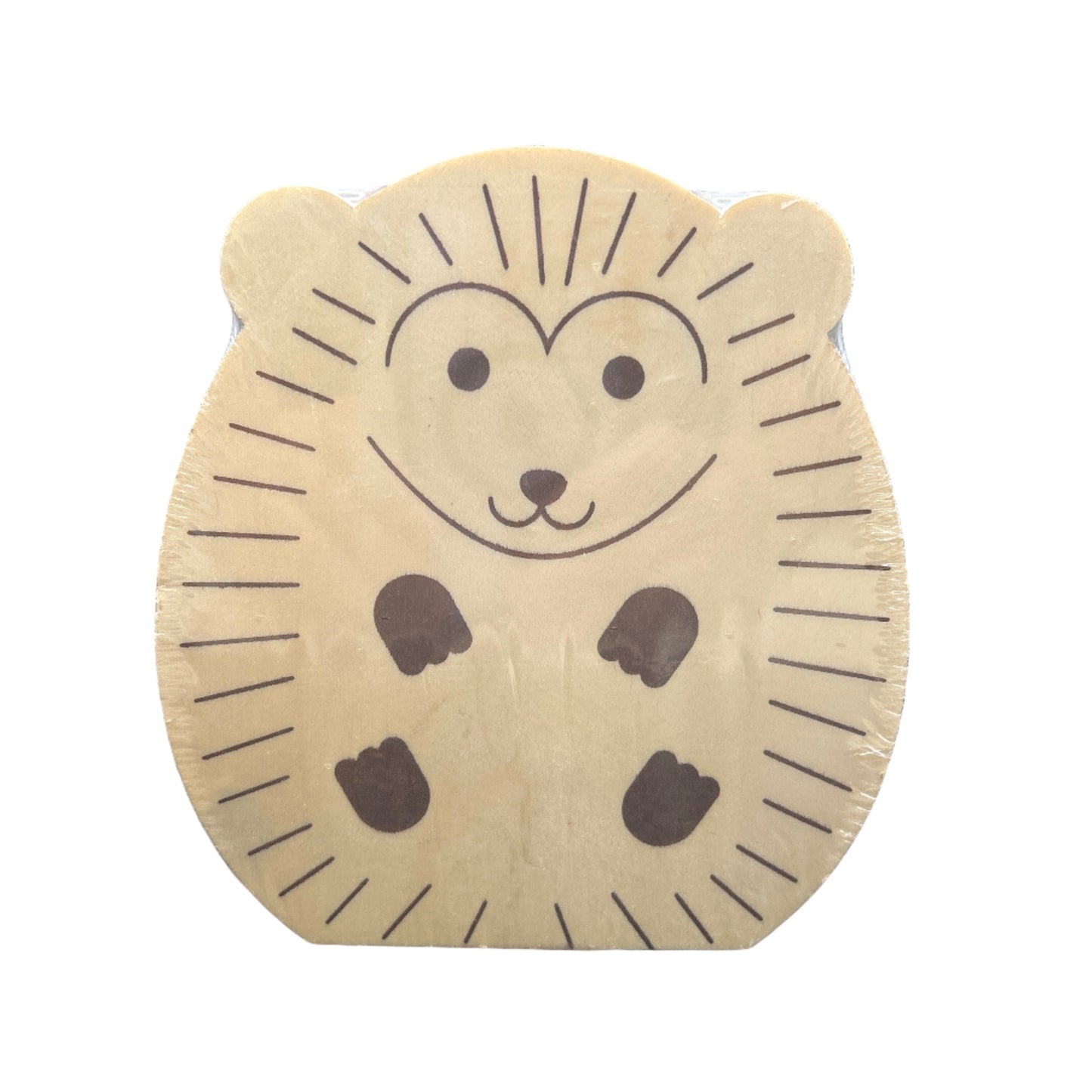 Gold cookie-shaped charm with a face on a black background