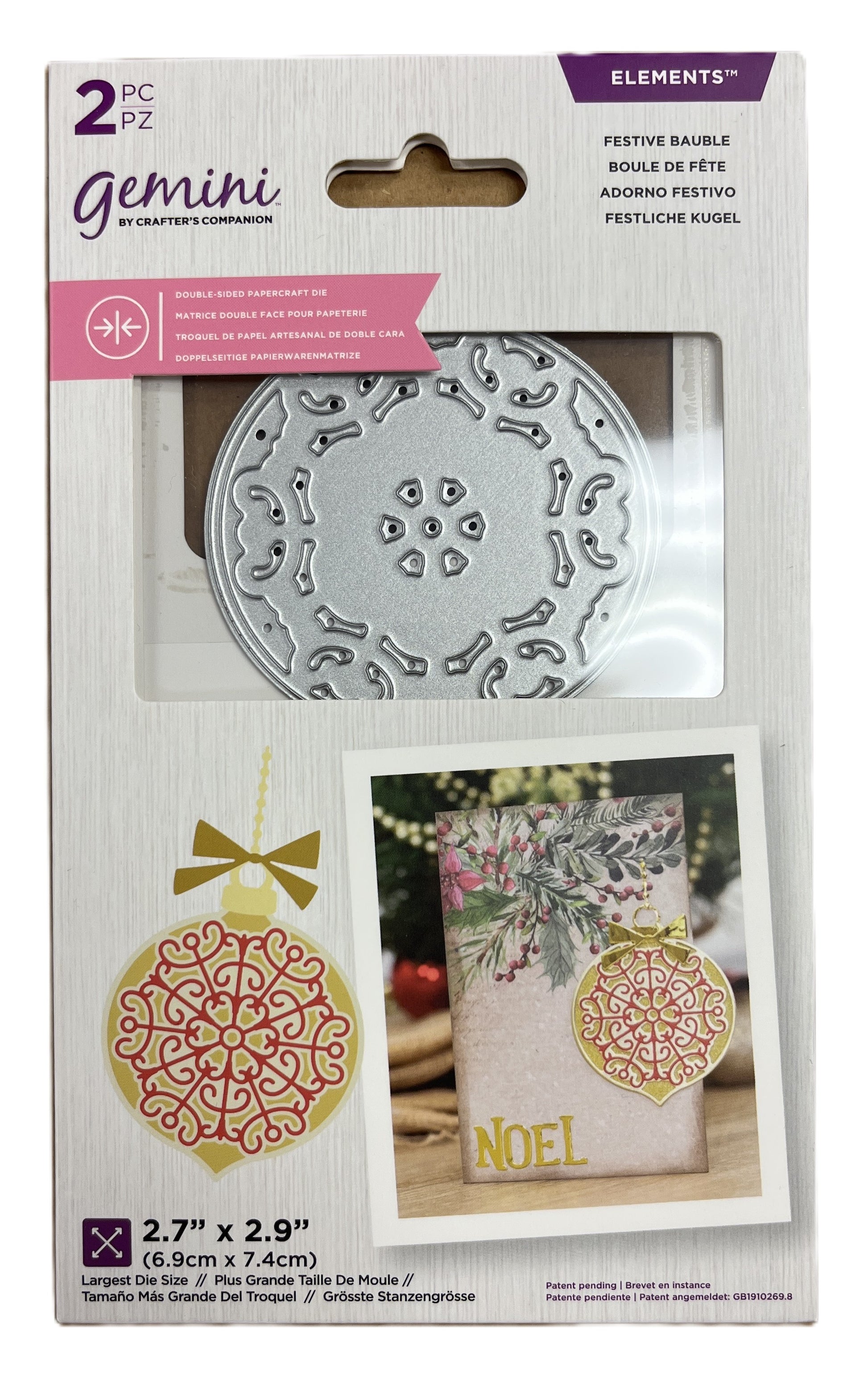 Packaged Gemini die set with decorative elements and a 'NOEL' card.