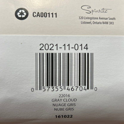 Close-up of a label on a yarn ball with text and a barcode.
