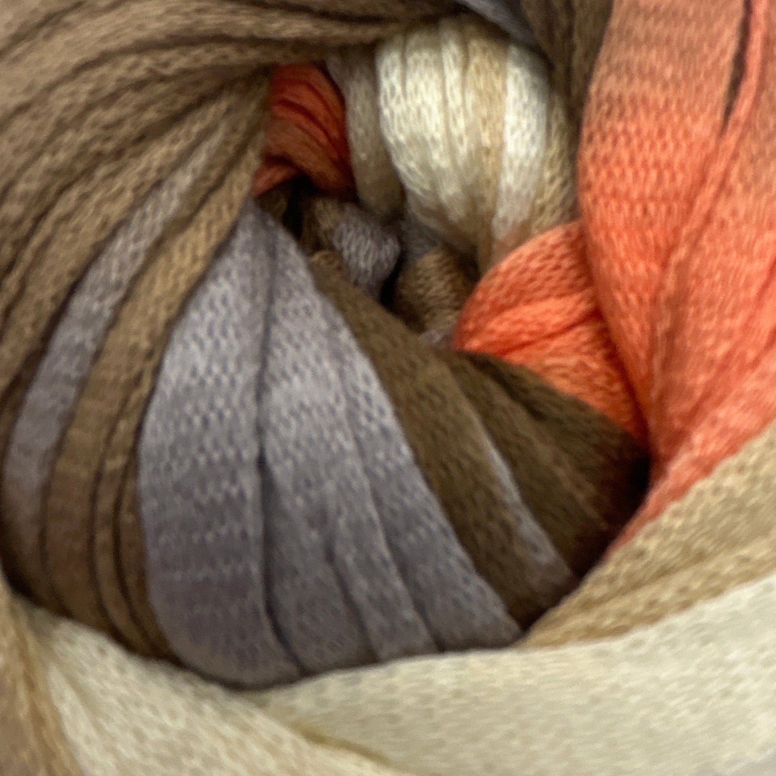 Multicolored skein of yarn on a white background