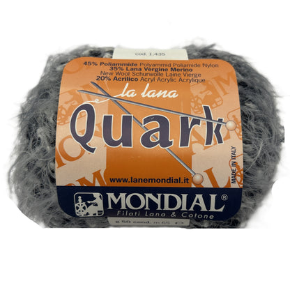 Ball of yarn with 'Quark' label on a white background