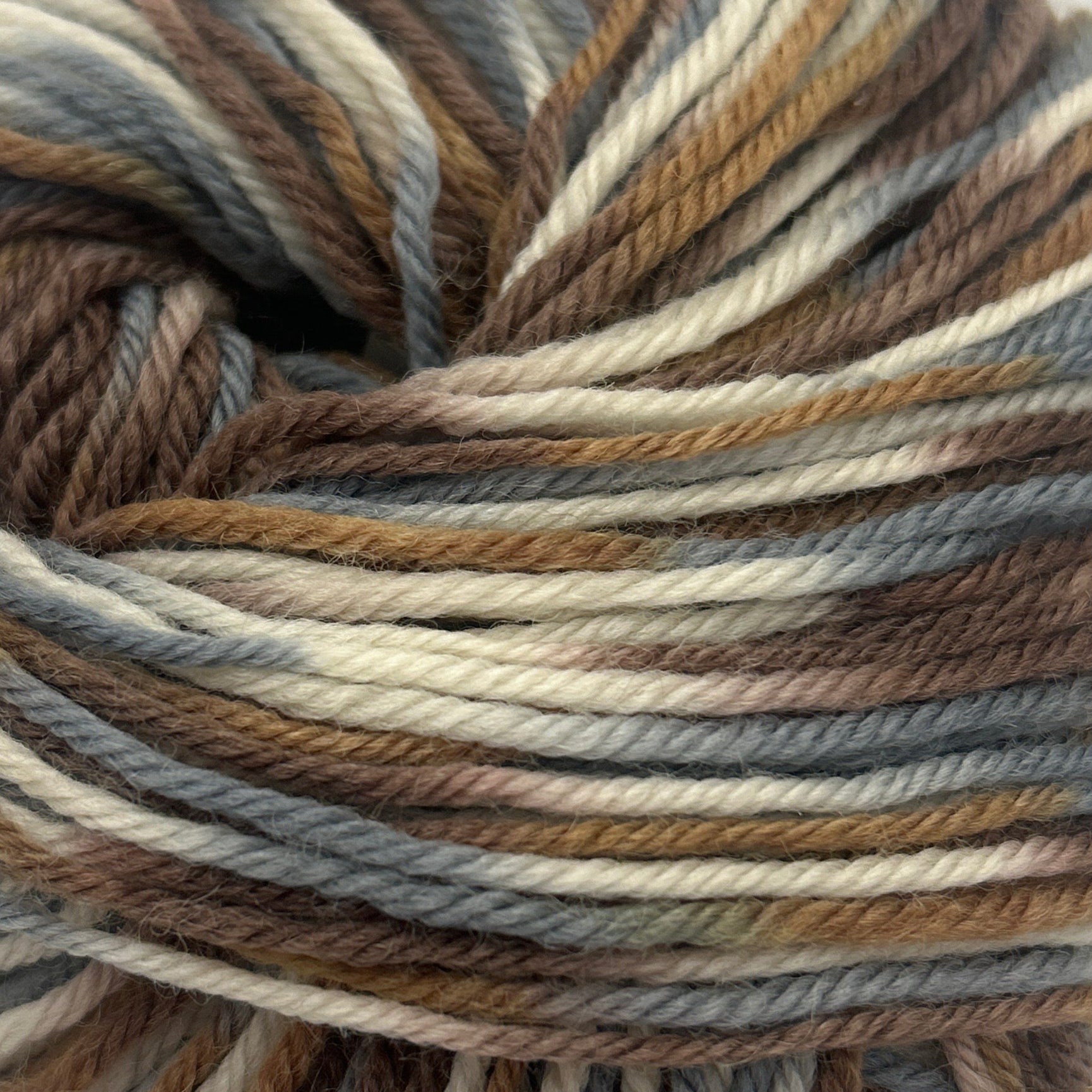 Multicolored skein of yarn on a white background