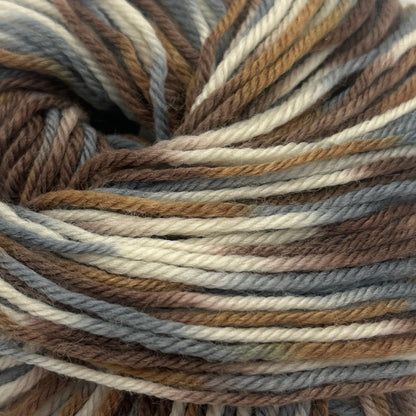 Multicolored skein of yarn on a white background