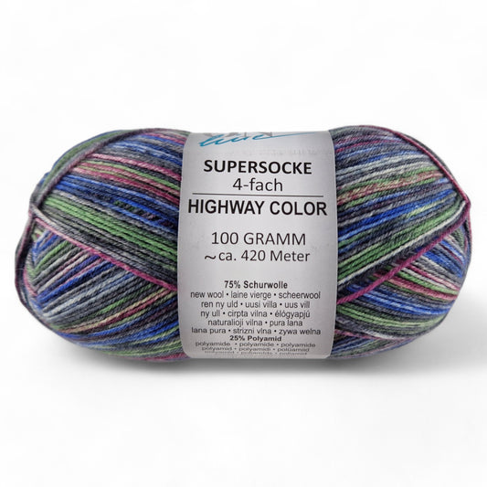 Multicolored skein of yarn with a label on a white background