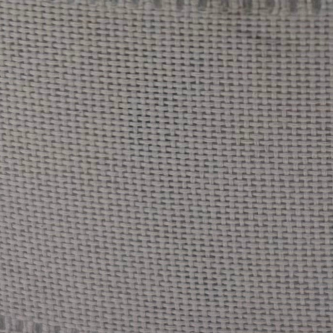 Spool of gray ribbon with a yellow label on a white background