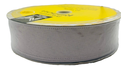 Spool of gray ribbon with a yellow label on a white background