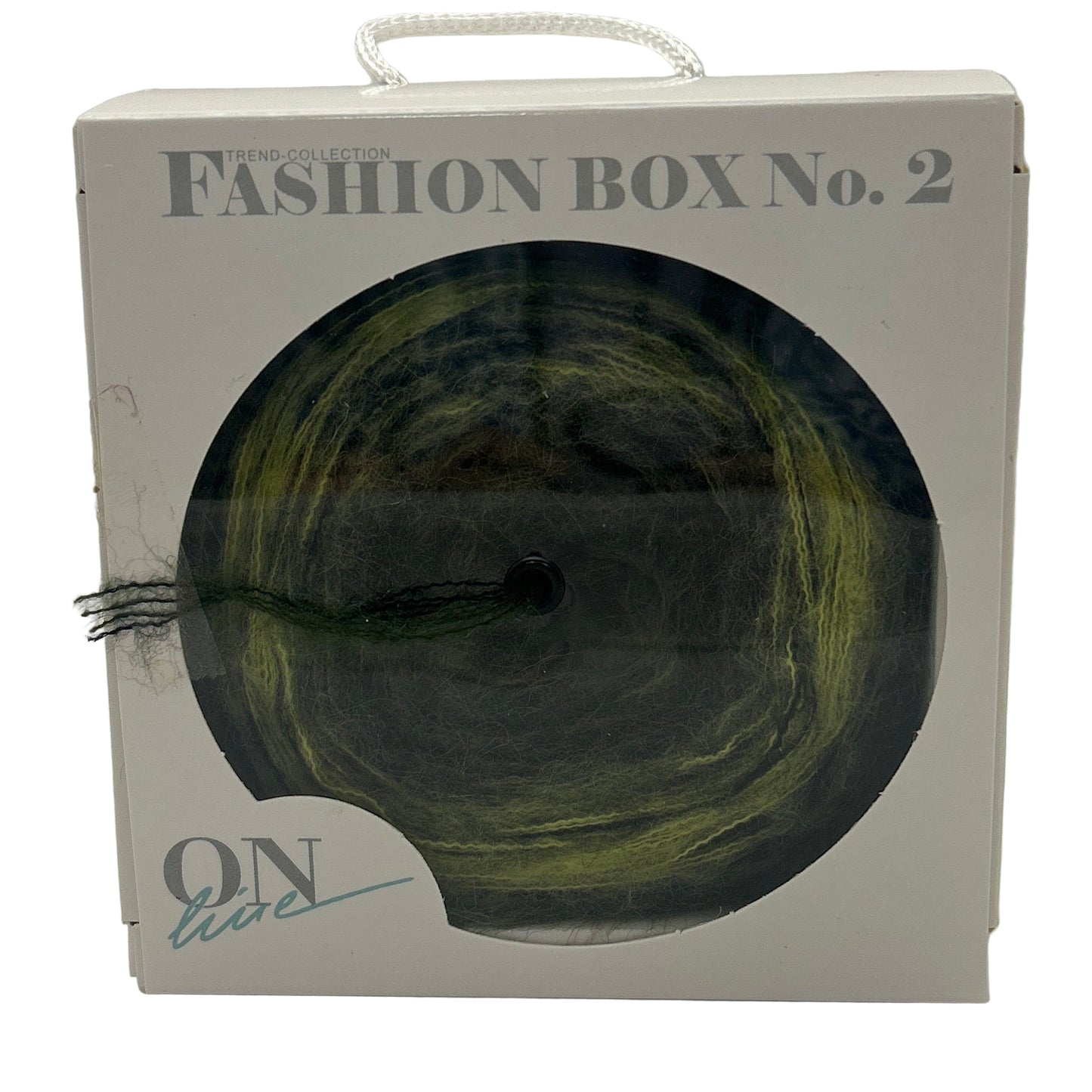 Fashion box with a green skein of yarn on a white background