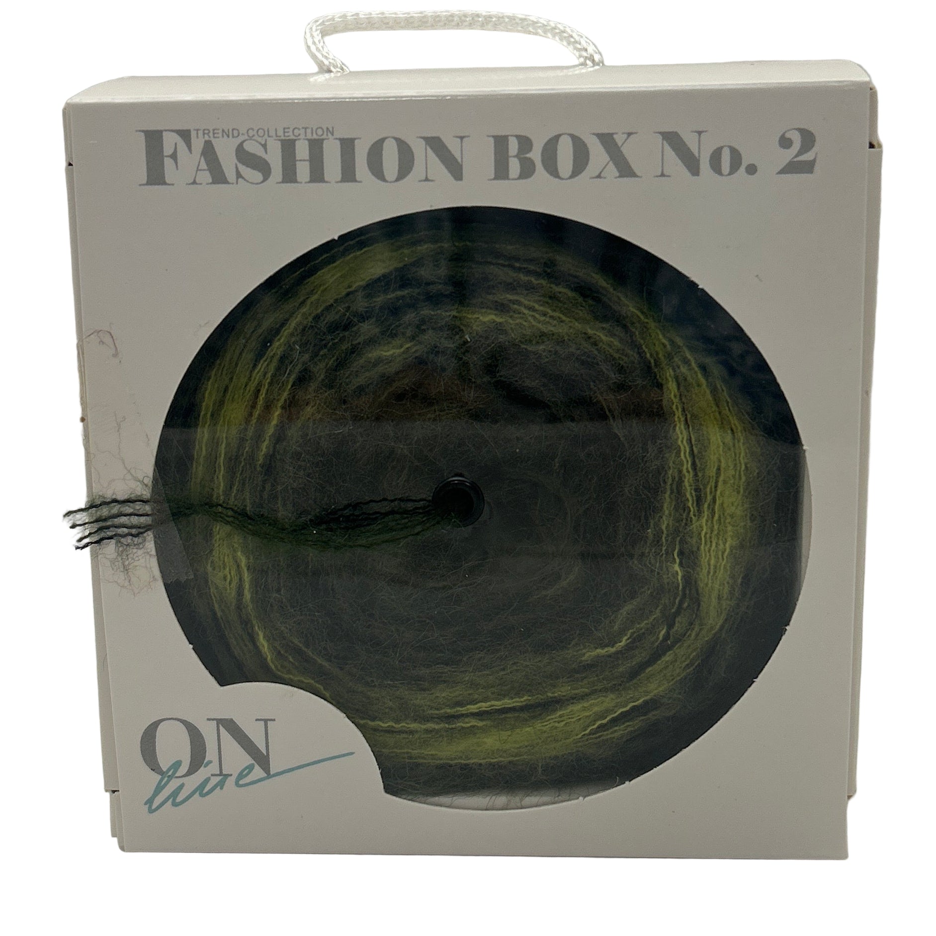 Fashion box with a green skein of yarn on a white background