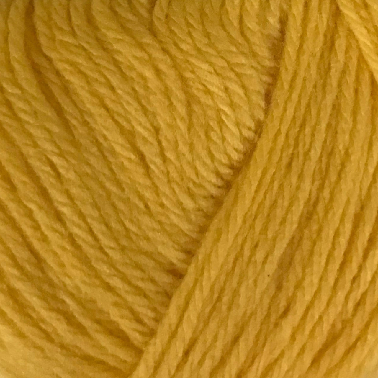 Close-up of a ball of yellow yarn