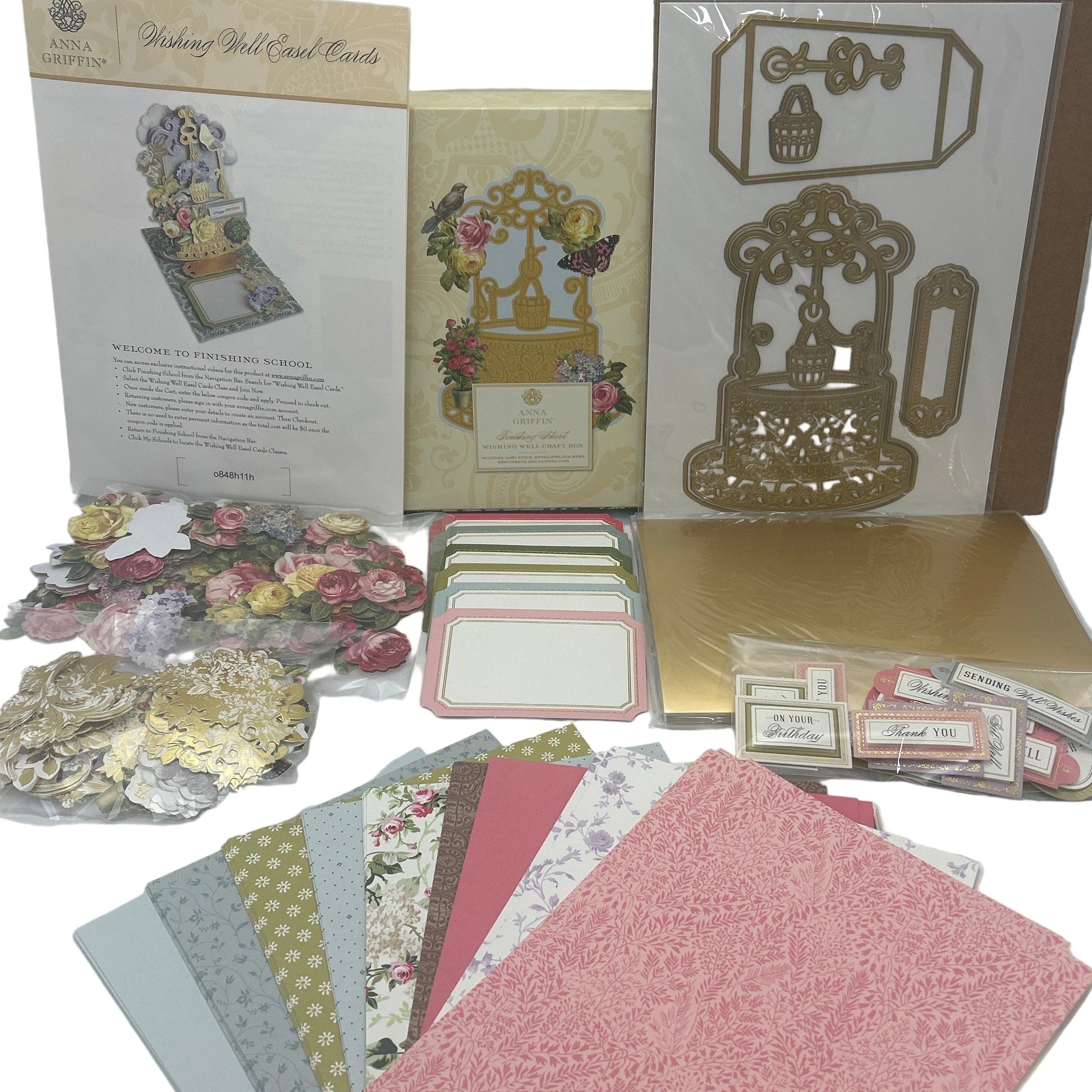 Collection of decorative paper, cards, and embellishments on a white background