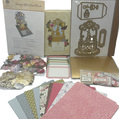 Collection of decorative paper, cards, and embellishments on a white background