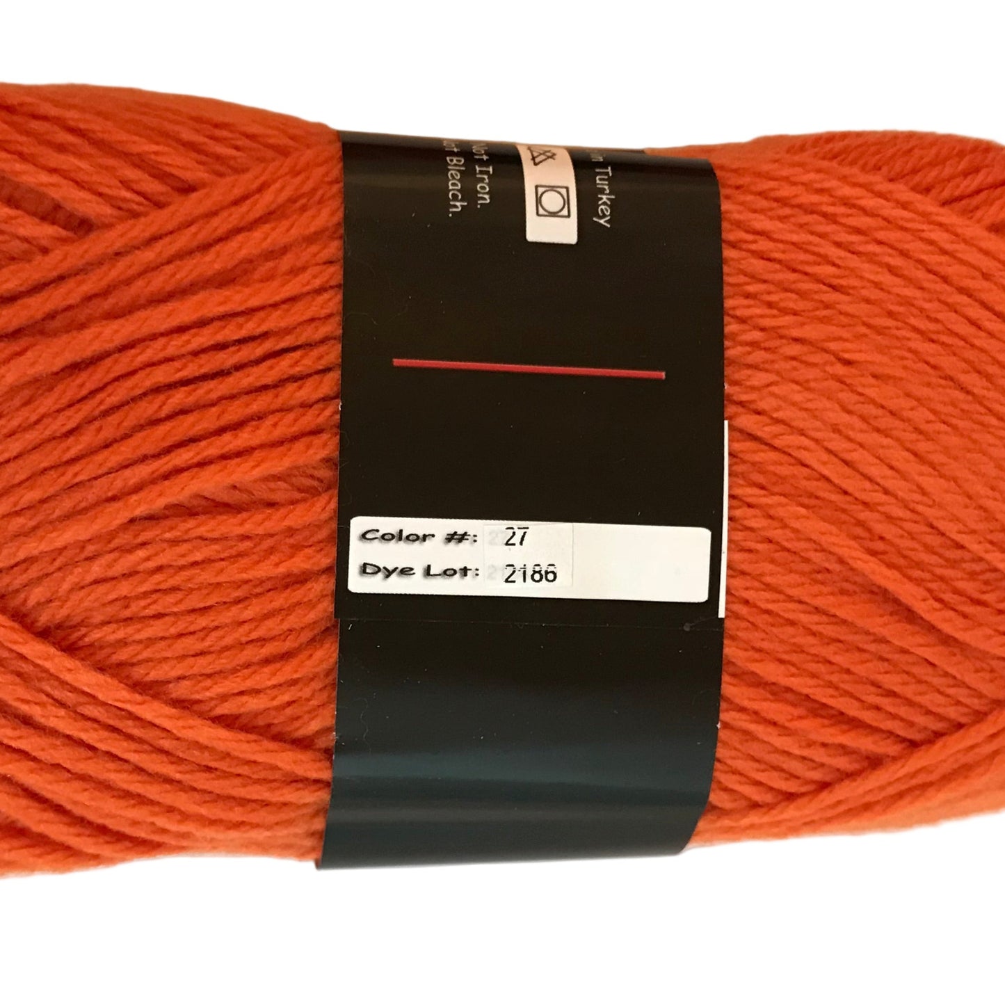 Orange skein of yarn with a label on a white background