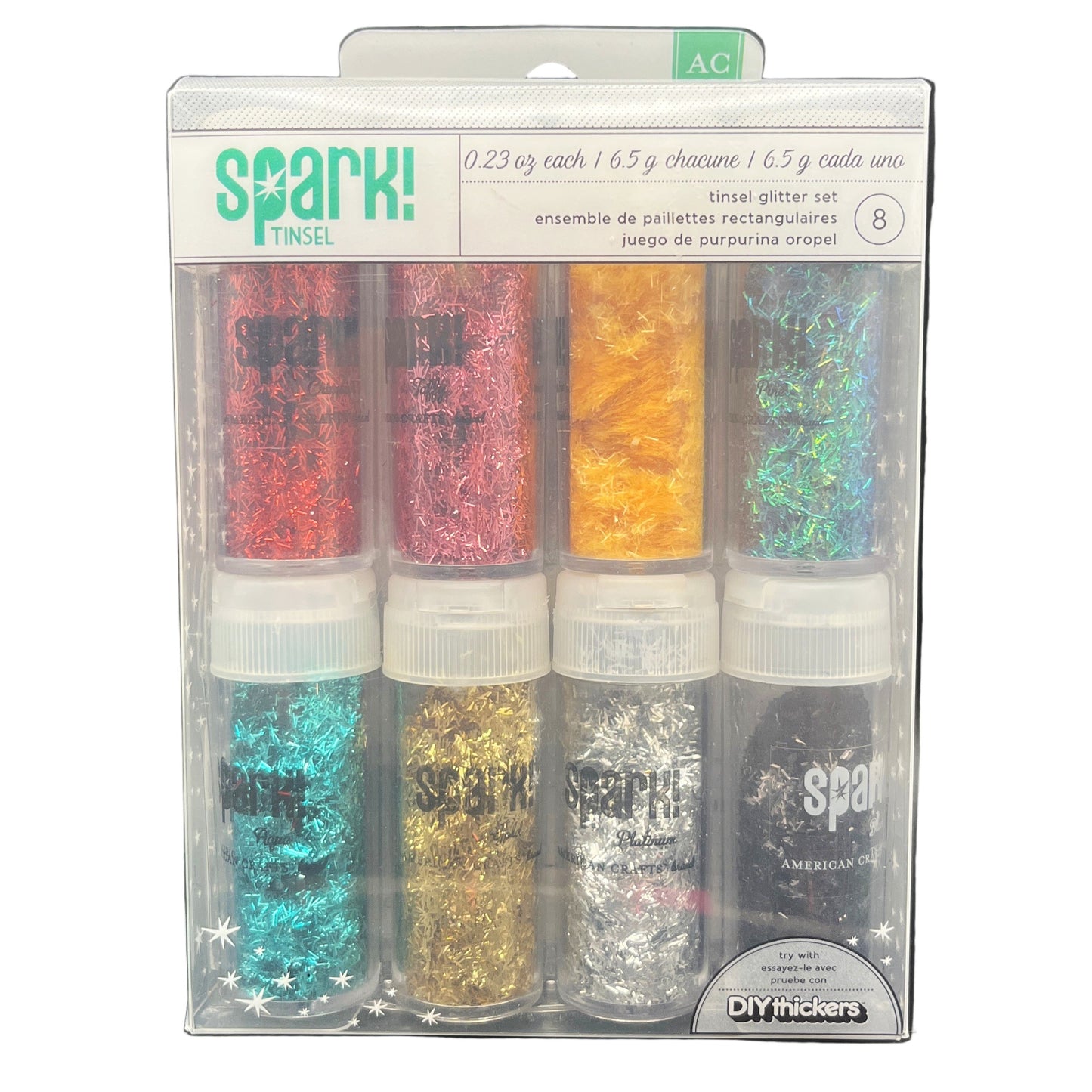 Packaged set of glitter bottles with 'Spark!' branding on a white background
