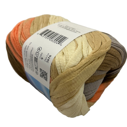 Ball of yarn with a label on a light gray background
