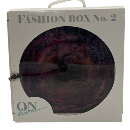 Fashion box with a circular product inside, labeled 'Fashion Box No. 2' on a white background.