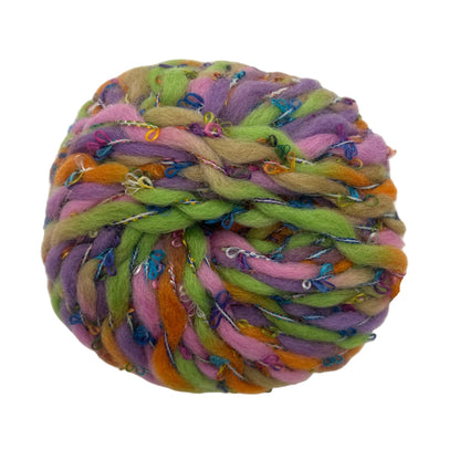 Colorful braided rope ball toy on a white background