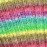 Close-up of colorful yarn with a rainbow pattern