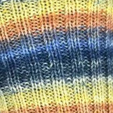 Multicolored striped sock on a white background