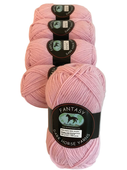 Three skeins of pink yarn with 'Fantasy' label on a white background