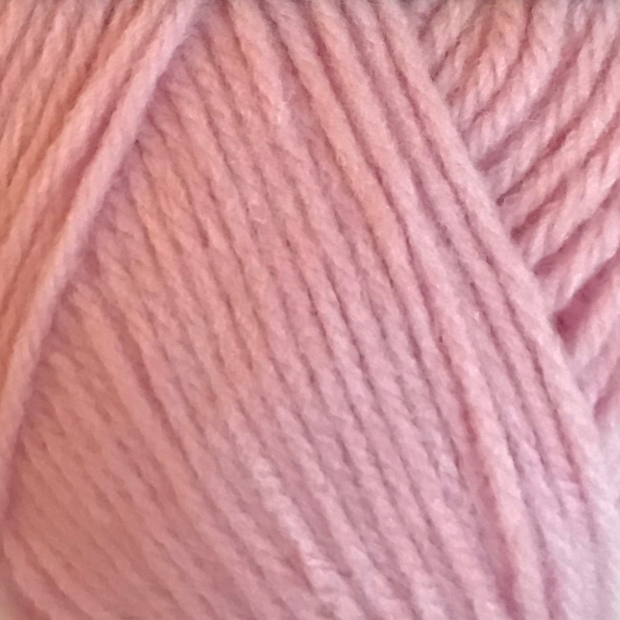 Close-up of pink yarn with a soft focus