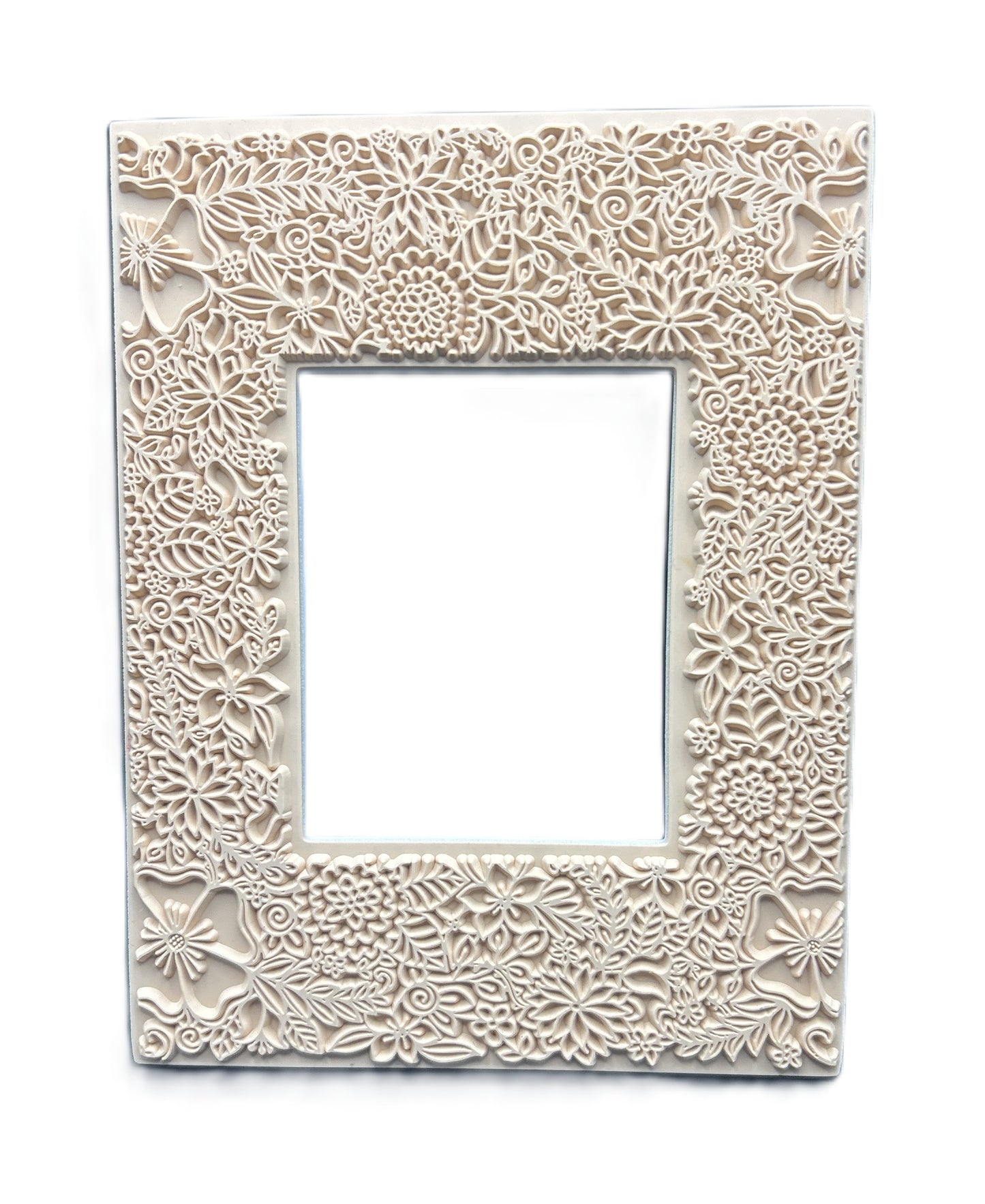 Decorative white frame with intricate floral patterns on a white background