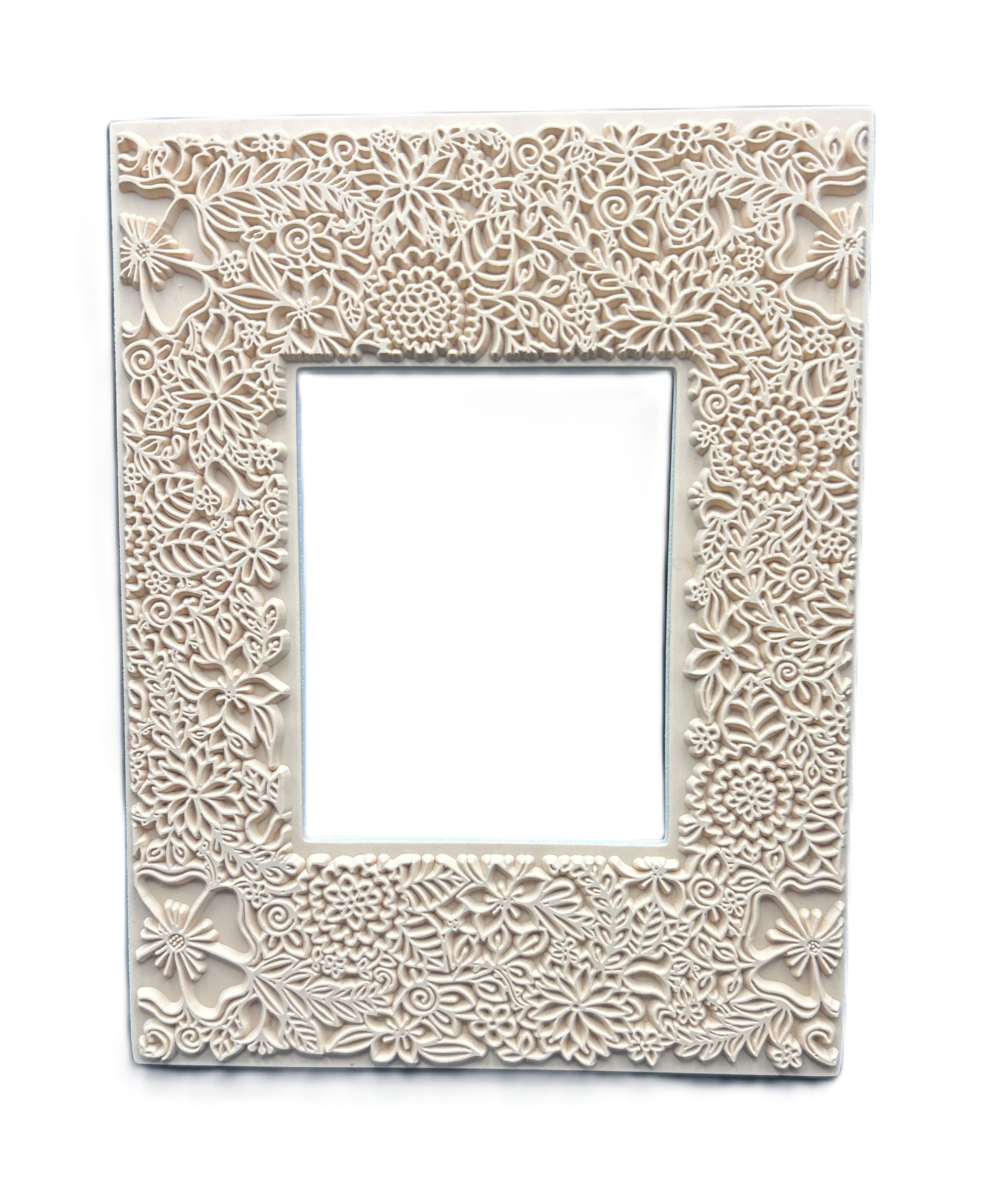 Decorative white frame with intricate floral patterns on a white background