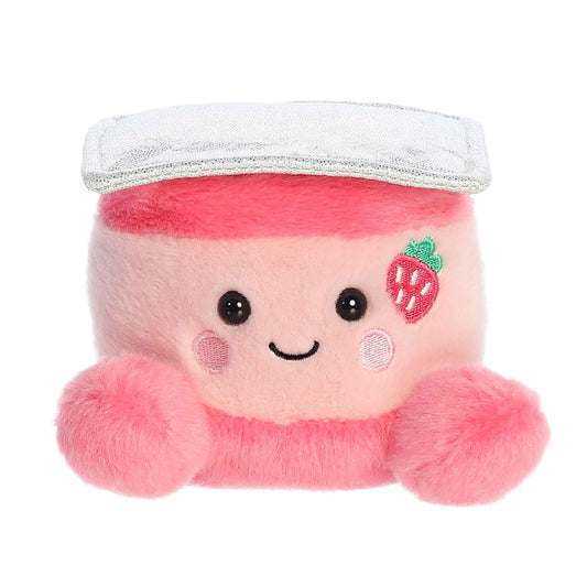 Plush toy with pink hair, white hat, and strawberry design on a white background