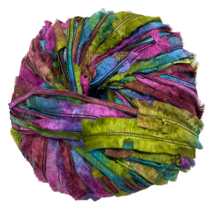 Multicolored yarn ball on a white background