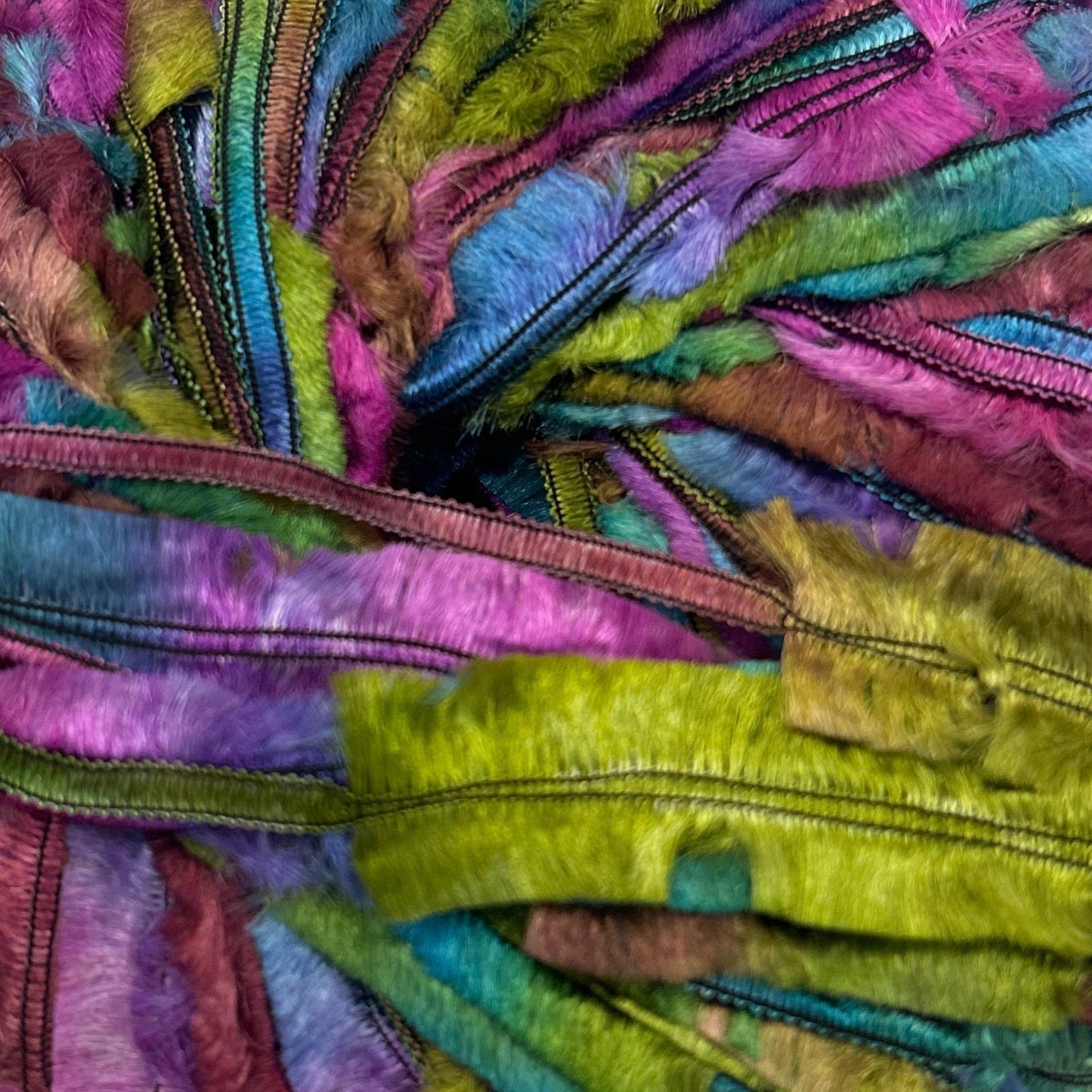 Multicolored skein of yarn on a white background
