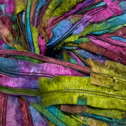 Multicolored skein of yarn on a white background