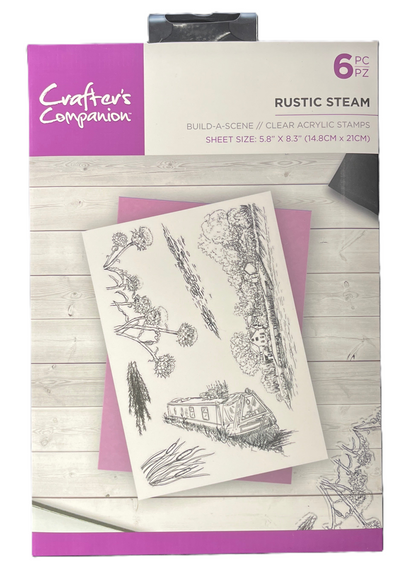 Crafters Companion rustic steam stamp set on a wooden surface with packaging.