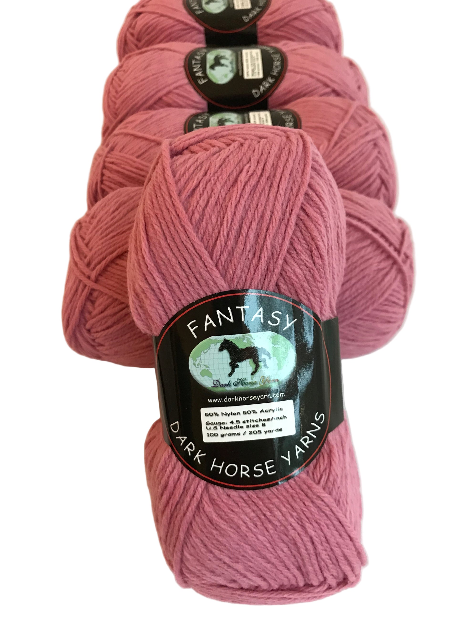 Pink yarn skeins with labels on a light background