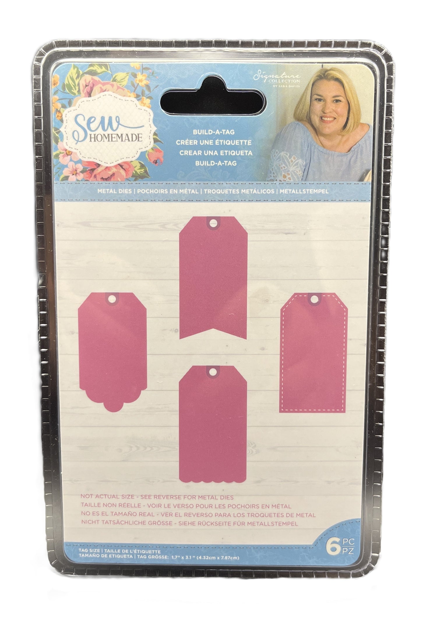 Packaging of metal tags with pink labels and a woman's face on the top right corner.