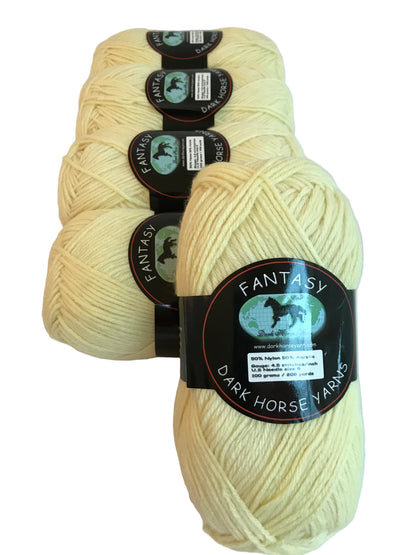 Three skeins of cream-colored yarn with 'Fantasy' labels on a white background