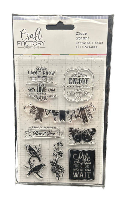 Packaged clear stamps with various designs and text from Craft Factory Creations.