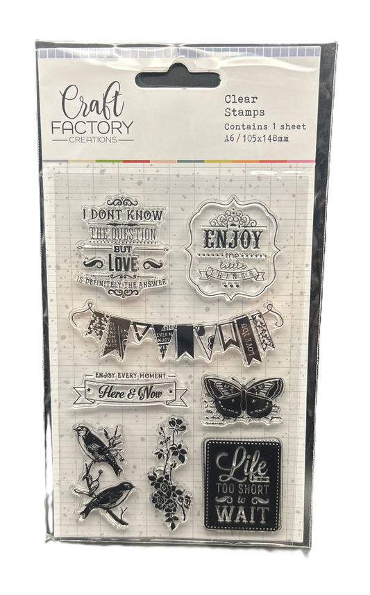 Packaged clear stamps with various designs and text from Craft Factory Creations.