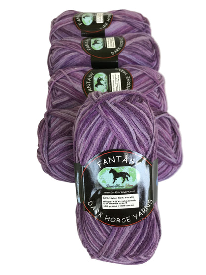 Three skeins of purple yarn with labels on a white background