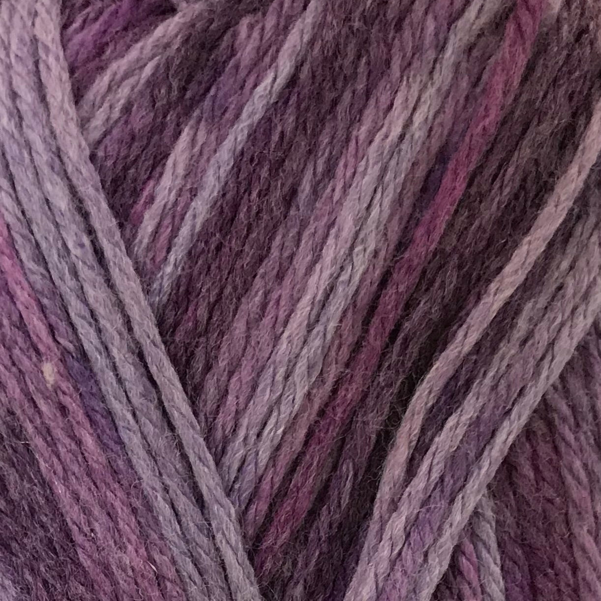 Close-up of purple and pink yarn strands