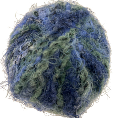 Blue and green textured ball on a white background