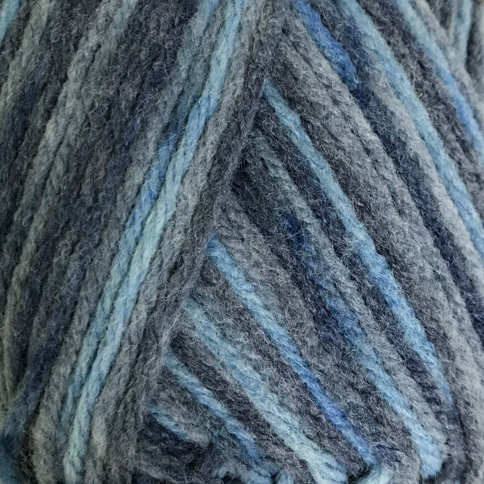 Blue striped yarn ball on a white background