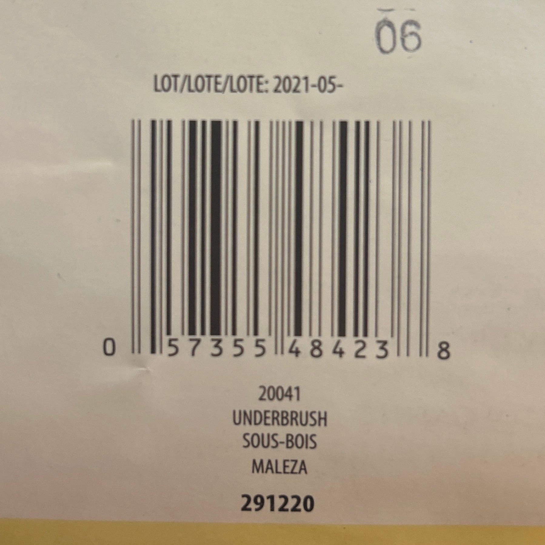Yarn ball with a label on a wooden surface
