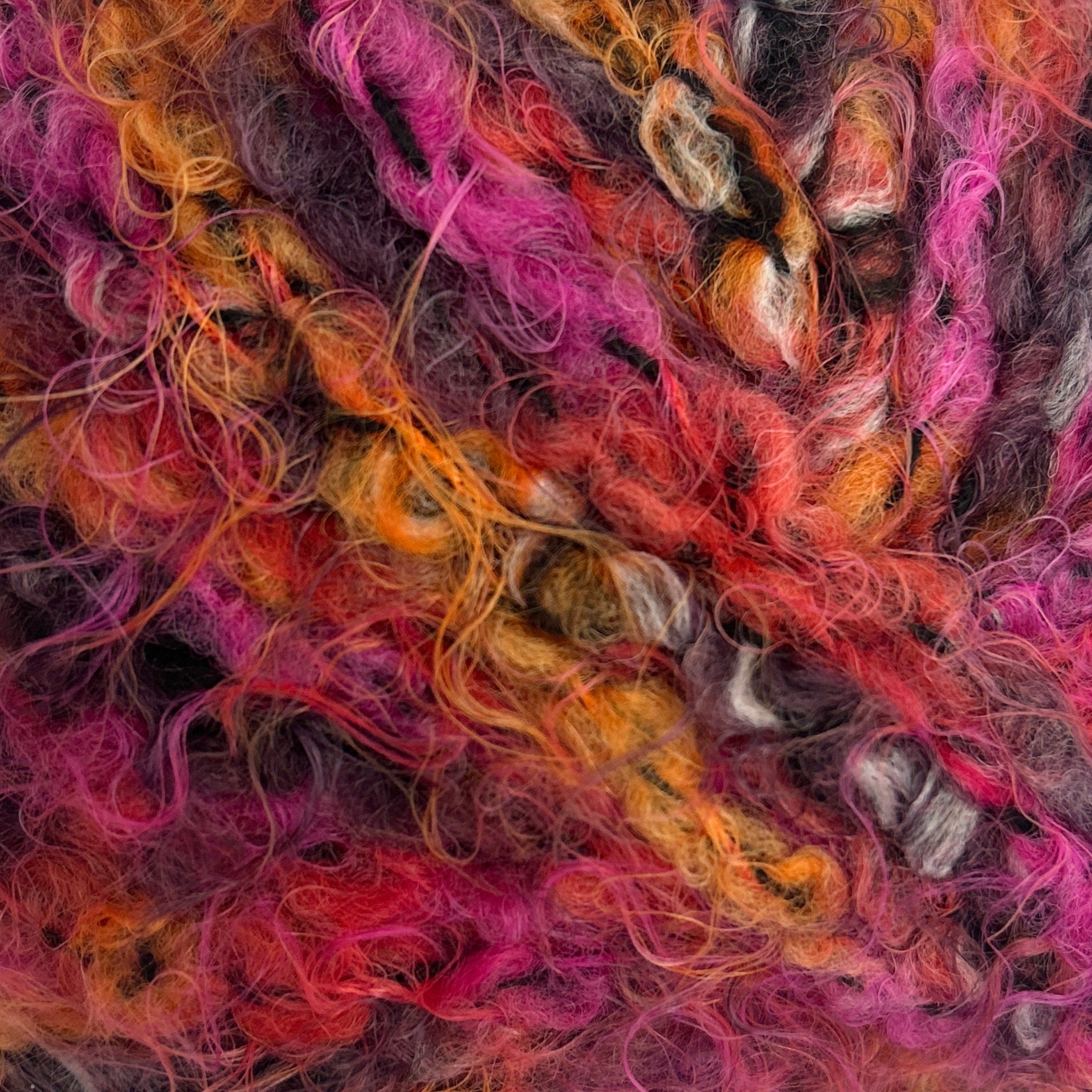 Multicolored skein of yarn on a white background