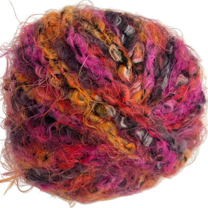 Multicolored skein of yarn on a white background